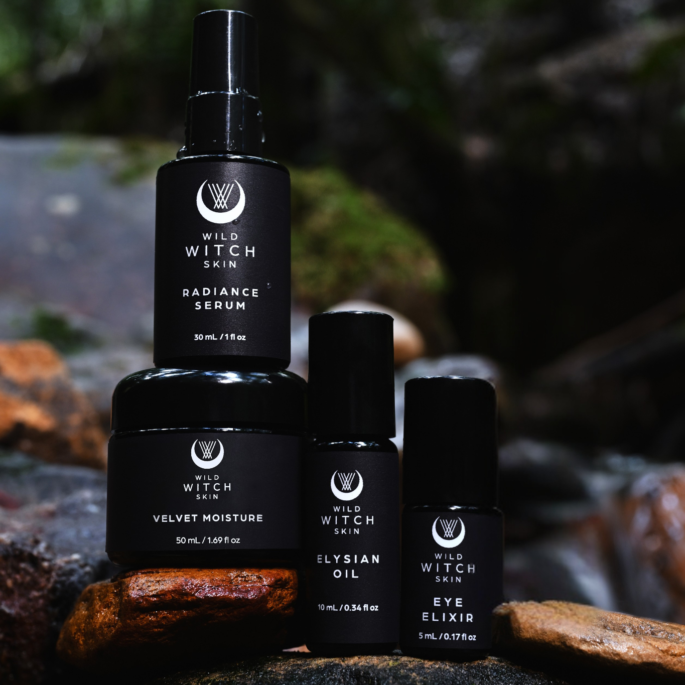Wild Witch Skin Collection sitting on rocks near a waterfall